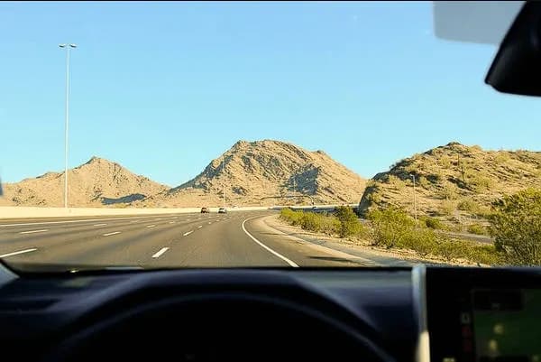 Long desert highway road trip between Muscat and Salalah in Oman